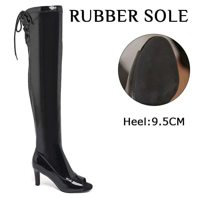 Black knee-high boot with rubber sole and heel measurement on a white background
