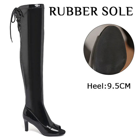Black knee-high boot with rubber sole and heel measurement on a white background